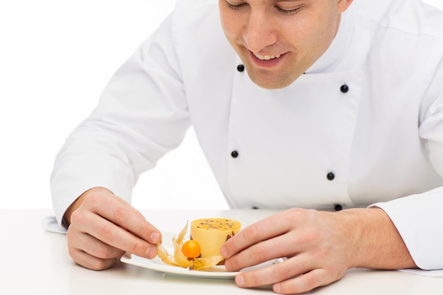 Chef preparing a dish in a bright kitchen